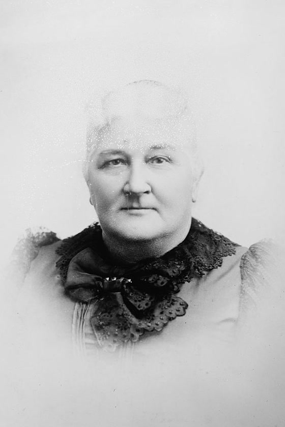 An old black-and-white portrait of an elderly woman